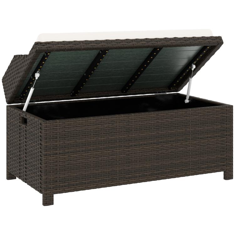 Outdoor wicker storage bench with open lid, dark brown frame, light cream cushion on top