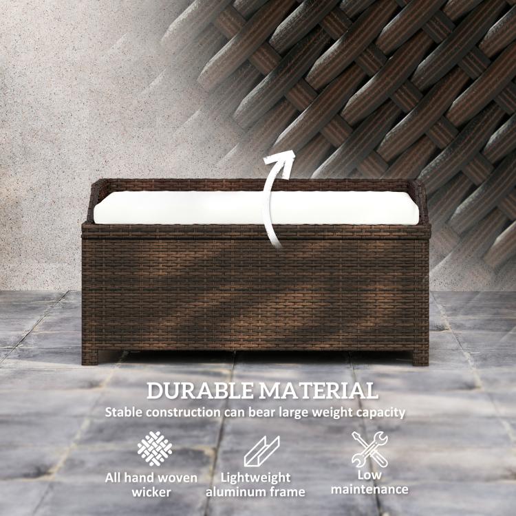 Outdoor wicker storage bench close-up with light cream cushion on dark brown woven frame