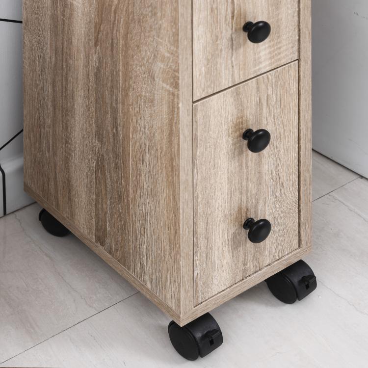 Oak bathroom cabinet with door, black knobs, and rolling wheels; open compartment