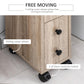 Oak bathroom cabinet corner view on rolling wheels with black knob door panels