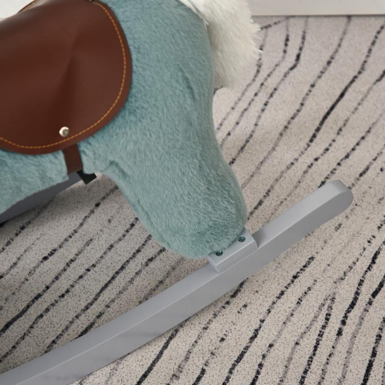 Blue plush rocking horse with brown saddle, gray rocker base, close-up side
