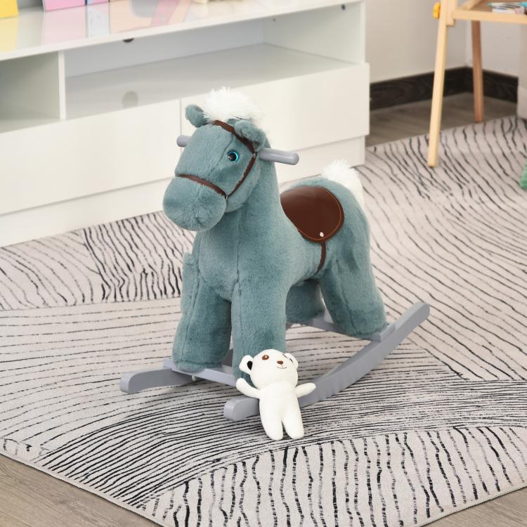 Blue plush rocking horse with bear toy on gray sled base, side view