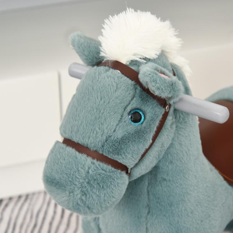 Blue plush rocking horse head with brown bridle and white mane, close-up