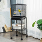 Black metal indoor bird cage on rolling stand with front access panel and storage basket
