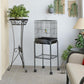 Black tall bird aviary cage on four wheels with side door and wire floor