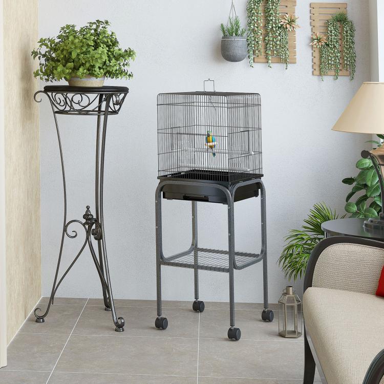 Black tall bird aviary cage on four wheels with side door and wire floor