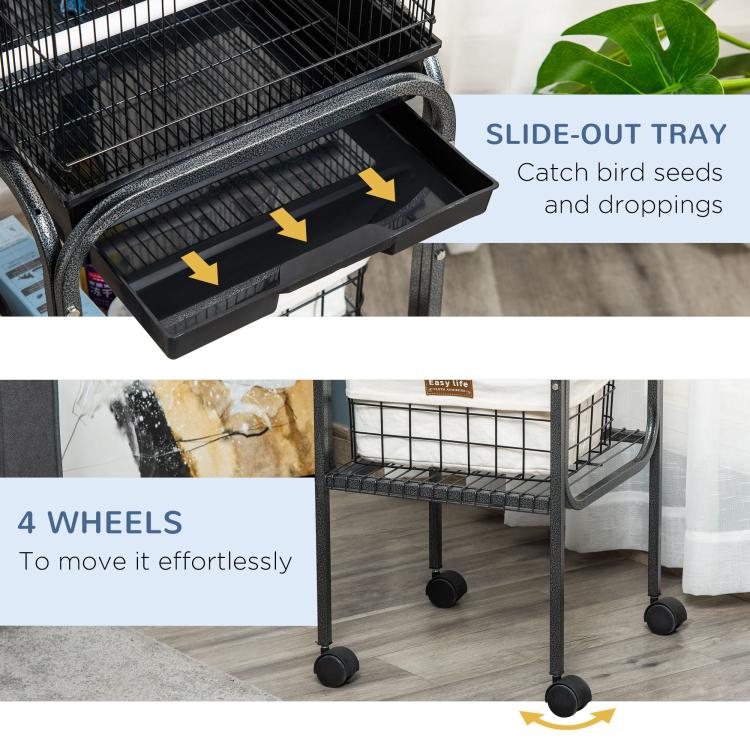 Black side-out tray on metal bird cage with wire bars