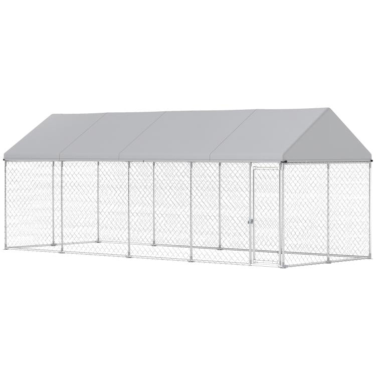 Chain-link outdoor dog kennel with gray roof and hinged door panel