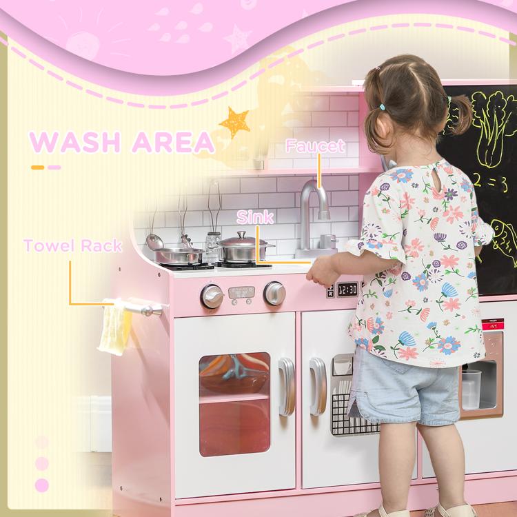 Pink kids play kitchen with sink area, towel rack, and stovetop controls