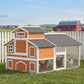Wooden chicken coop with gray shingle roof and enclosed run for chickens