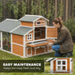 Wooden chicken coop with slide-out tray at front and fenced run side panel