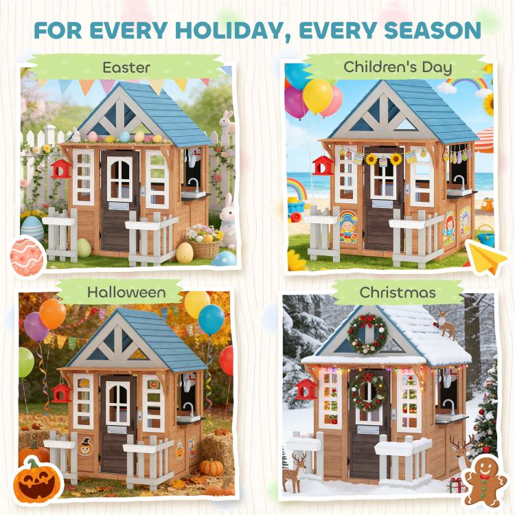 Seasonal decorated wooden playhouse with blue roof, windows, fence, and mailbox