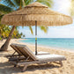 Khaki thatched patio umbrella with two-tier fringed canopy and central pole
