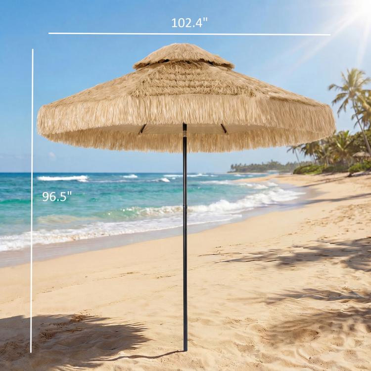 Khaki thatched patio umbrella with straw fringe and black pole, open canopy with fringe edge