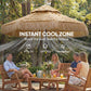 Khaki thatched patio umbrella canopy with straw fringe and black pole, open over seating