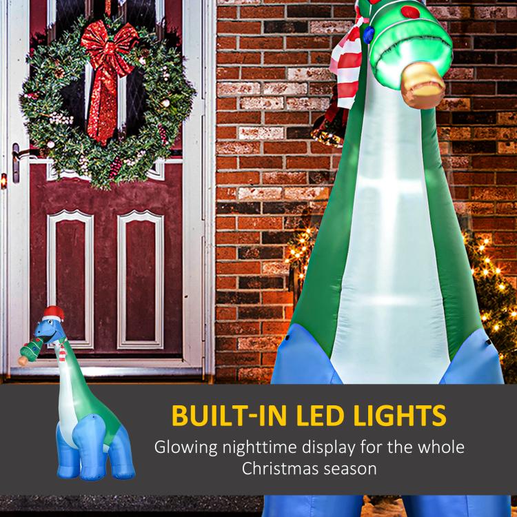 Inflatable dinosaur decoration with built-in LED light glow and Christmas tree in mouth