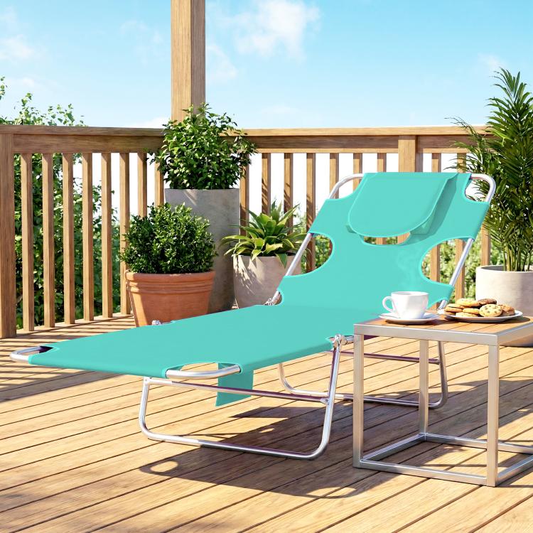Light green outdoor folding lounge chair with face hole and cushioned head pillow