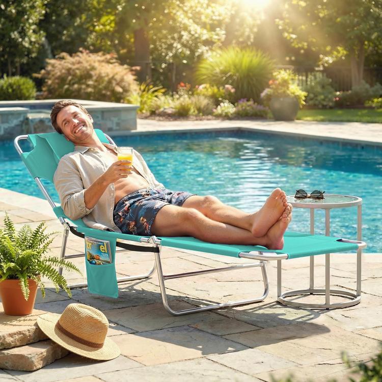 Light green reclining outdoor chaise lounge chair with face hole and cushioned head pillow