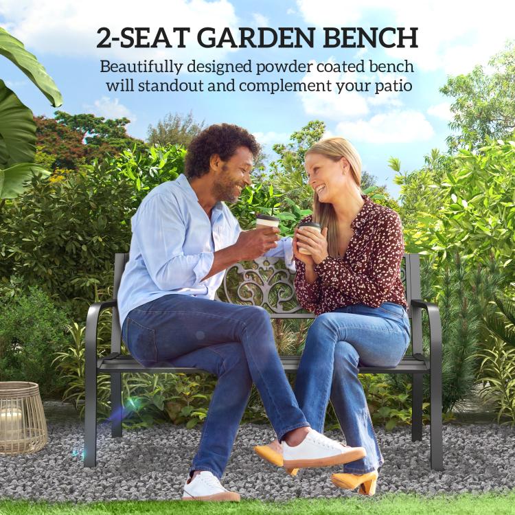 Black metal garden bench with decorative scrollwork backrest and two-seat design
