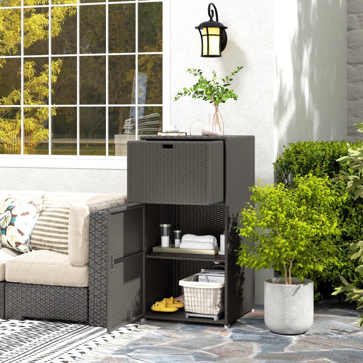Outdoor towel storage cabinet with open door and drawer, dark wicker weave