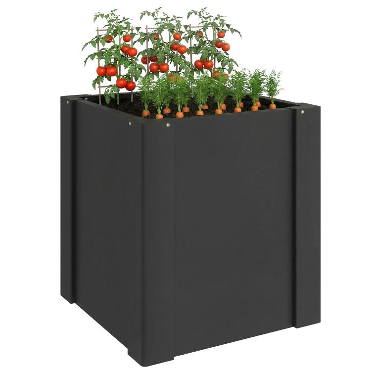 Black raised garden bed planter box with leafy seedlings and tomato plants on top