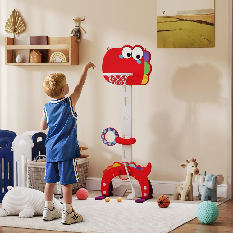 Red kids basketball hoop with cartoon backboard set up indoors for children to shoot