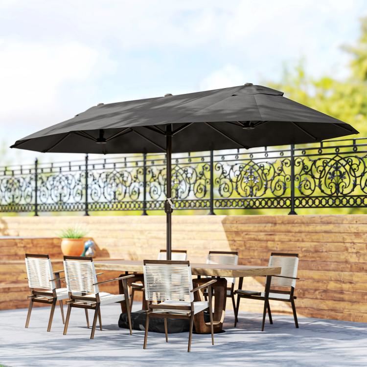 Rectangular dark gray patio umbrella over outdoor dining set on patio