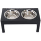 Black elevated dog feeding station with two stainless-steel bowls, front view