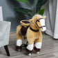 Light brown plush ride-on horse with dark saddle, wooden handle, and four caster wheels