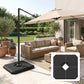 Dark umbrella stand base weight on patio with central opening for cantilever pole