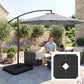 Cantilever umbrella with dark base weight on patio tiles and central opening
