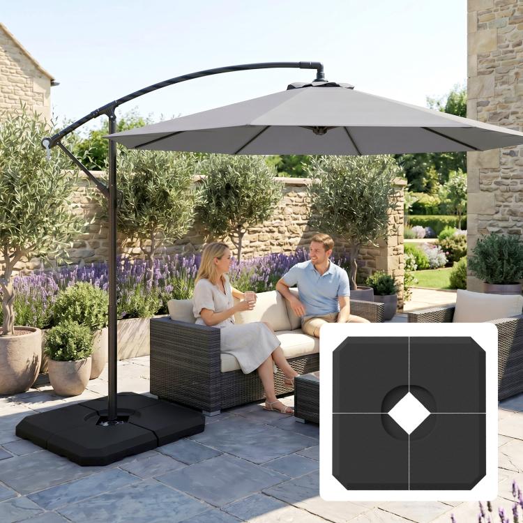 Cantilever umbrella with dark base weight on patio tiles and central opening