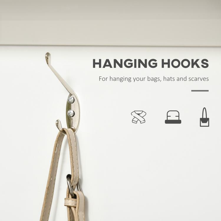 Metal coat rack hooks on white hall tree for hanging bags, hats, and scarves
