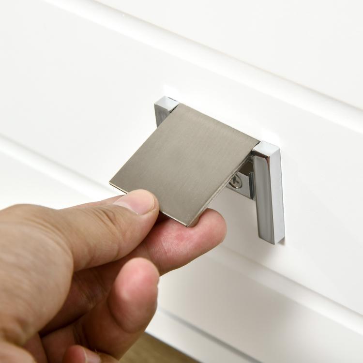 Metal cabinet fastener connector on white panel