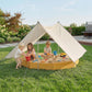Yellow octagon wooden sandbox with beige canopy and four built-in bench seats.
