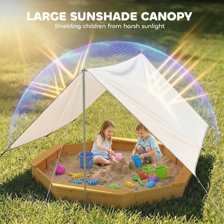 Yellow octagon wooden sandbox with beige sunshade canopy over sand play area.
