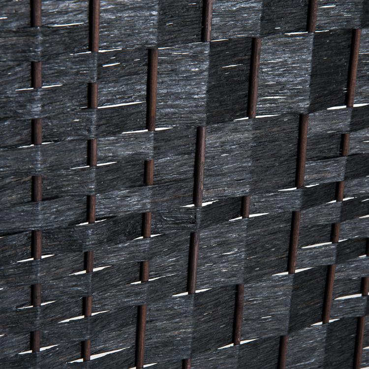 Close-up of black hand-woven lattice diamond pattern on folding room divider