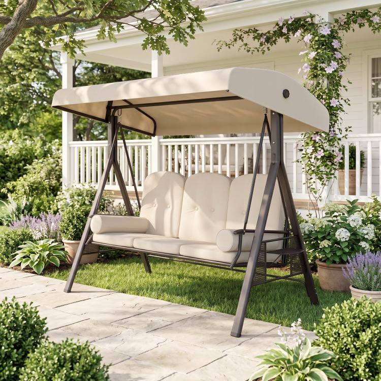 Beige 3-seat porch swing with canopy over padded bench and end support pillows