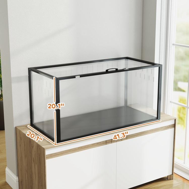 Acrylic pet cage with black frame on wood-and-white cabinet with clear walls