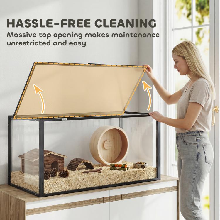 Large acrylic hamster cage with hinged top open for easy access, bedding inside