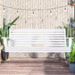 White 3-seat wooden porch swing on chains with slatted backrest and side table