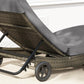 Gray outdoor wicker chaise lounge with adjustable back and two wheels, close-up