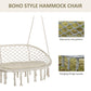 Boho macrame hammock chair with round net, cream cushion, and dangling rope fringe