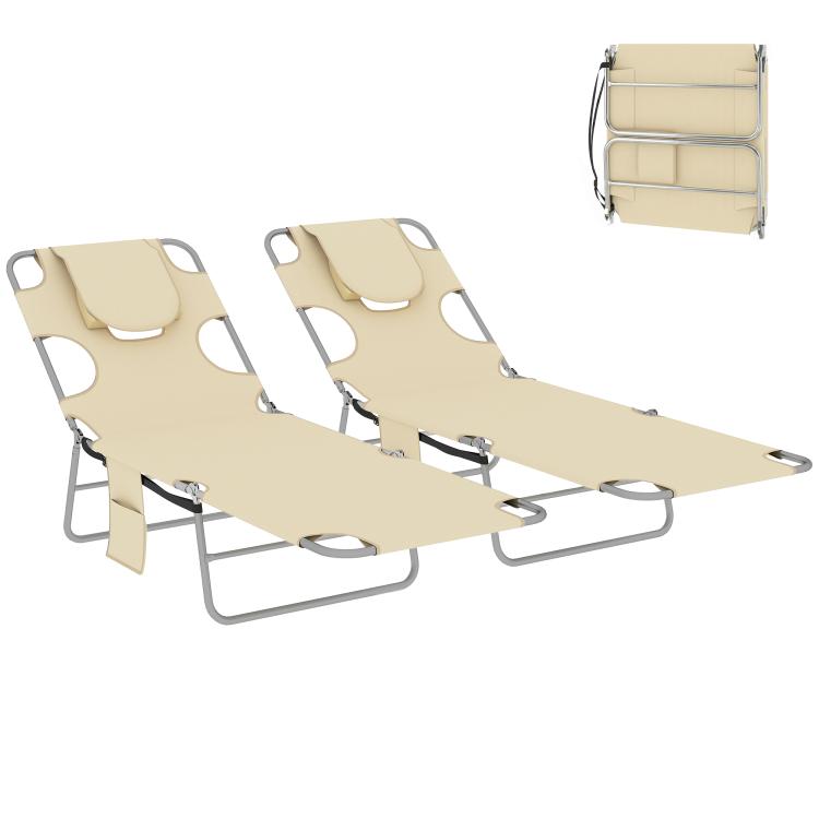 Two beige tanning chaise lounges with face pillows, steel frames, and arm cutouts