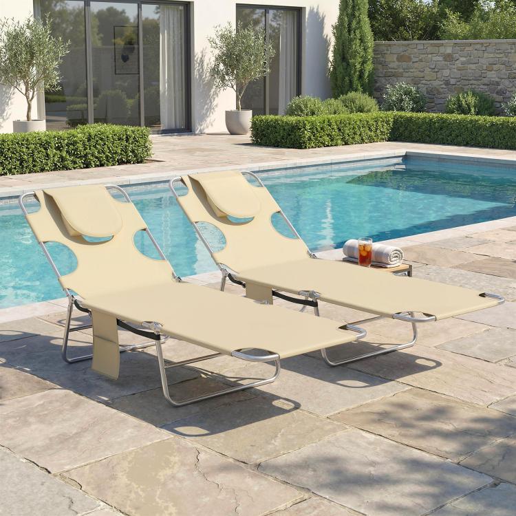 Beige outdoor adjustable tanning chaise lounges with face holes and head pillows, set of 2