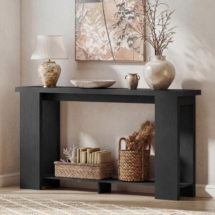 Distressed black console table with thick top and open center shelf for decor
