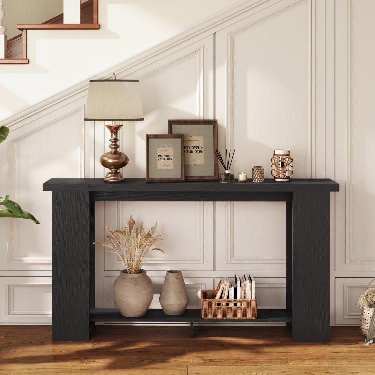 Distressed black console table with thick tabletop and two open shelves for decor