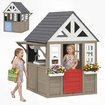 Gray wooden kids playhouse with side door, windows, and dark gray roof shingles