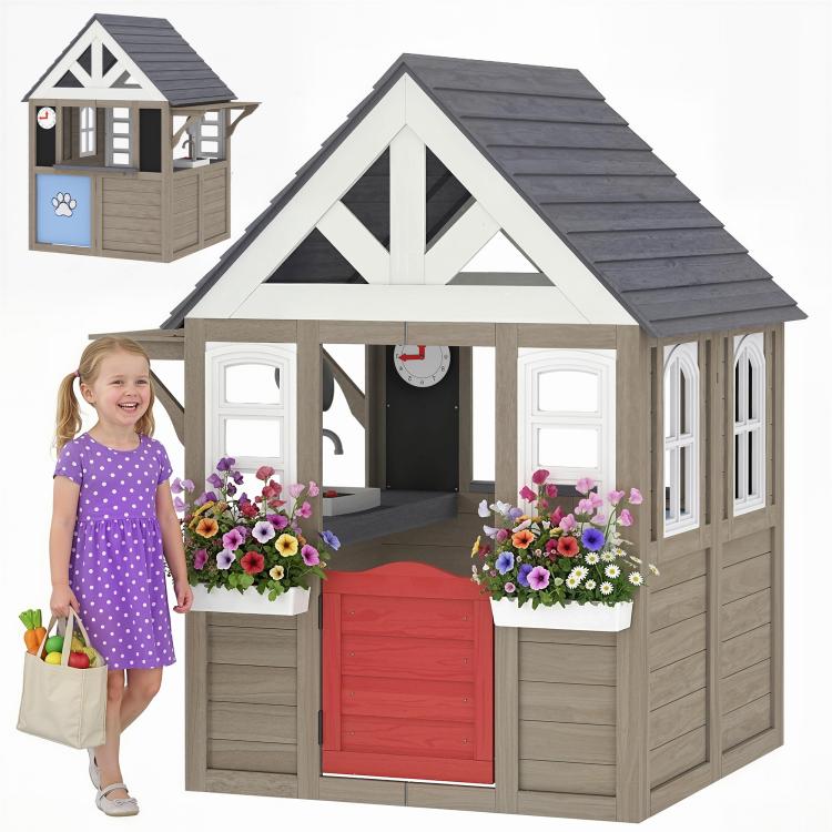 Gray wooden playhouse with front half-door, flower boxes, and tall windows under gable roof