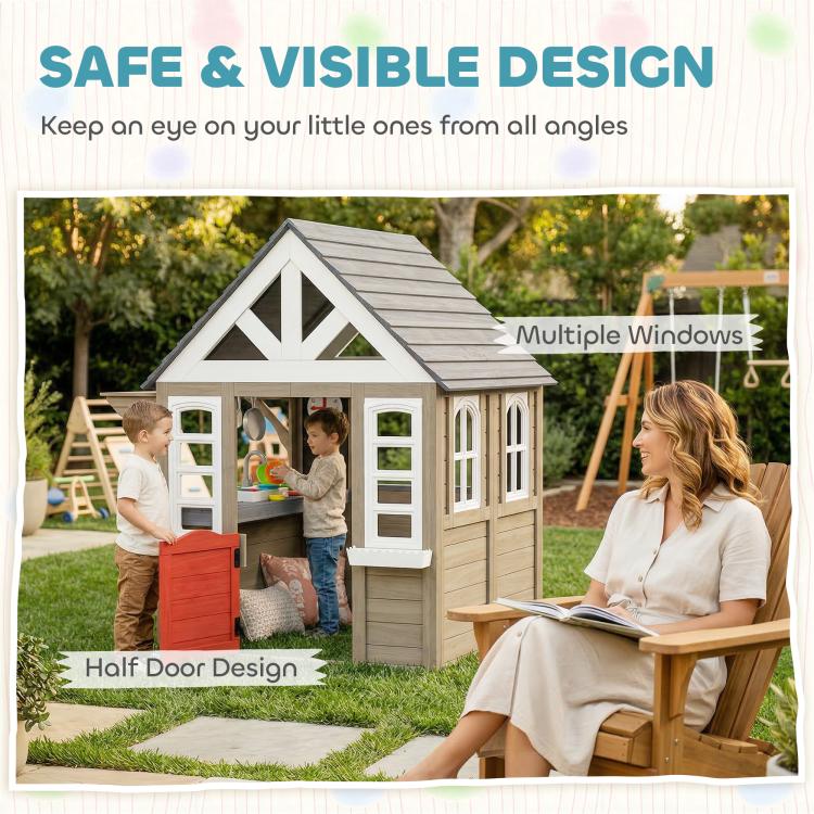 Gray wooden playhouse with multiple windows and half-door design in outdoor scene